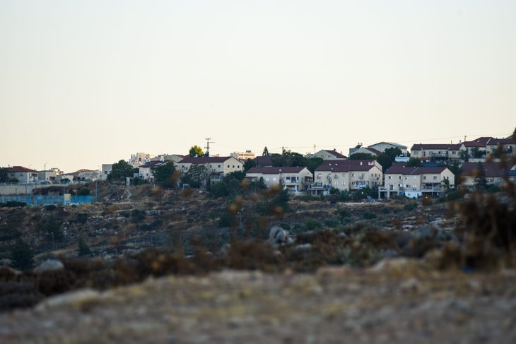 An Israeli settlement above the Palestinian village of Burqa in the occupied West Bank
