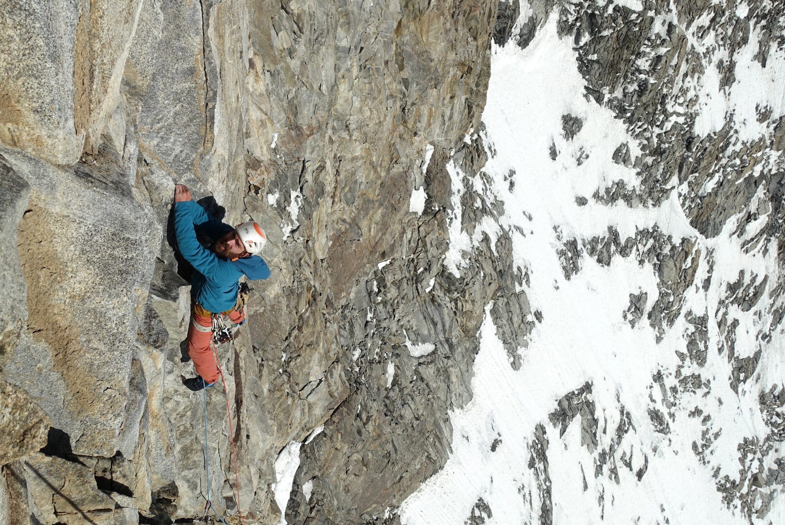 climber on steep granite wall