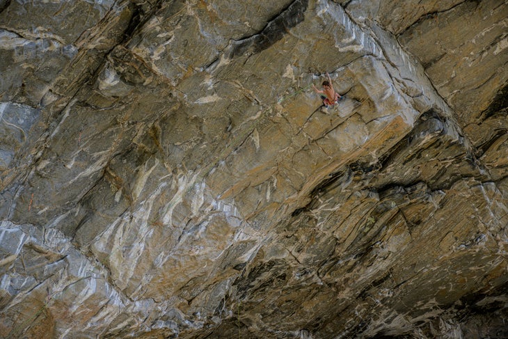 Climber midway through sending the longest 5.15a in Norway.
