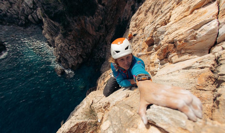 Ola Taistra rock climbing above water