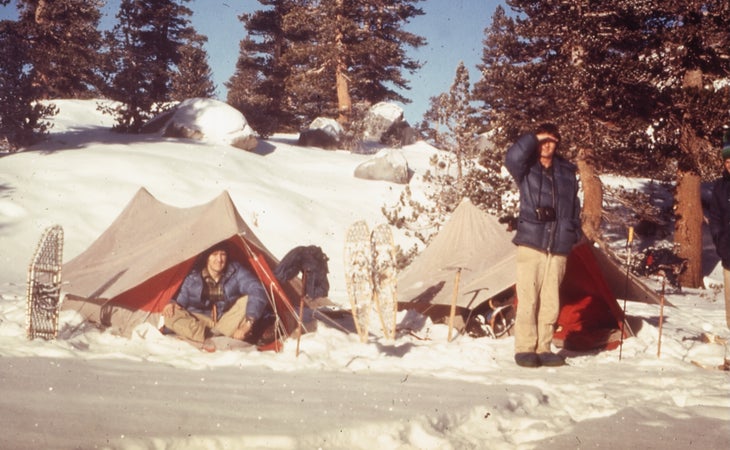 two men camping on a frozen lake