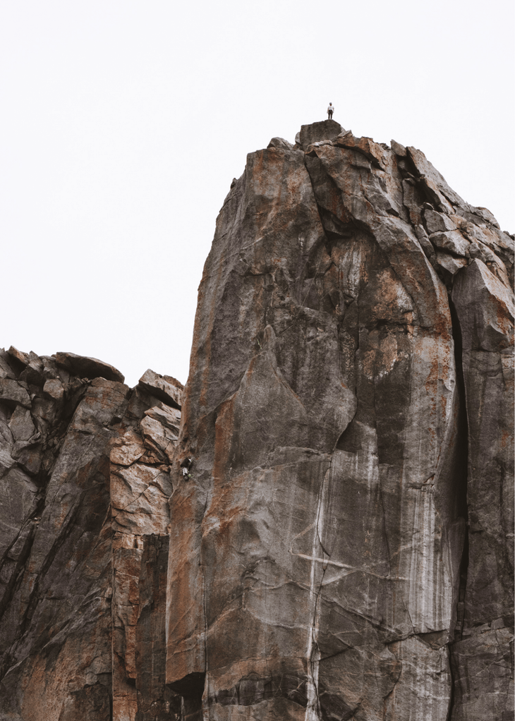 Woman stands on the top of Lost Temple Spire.