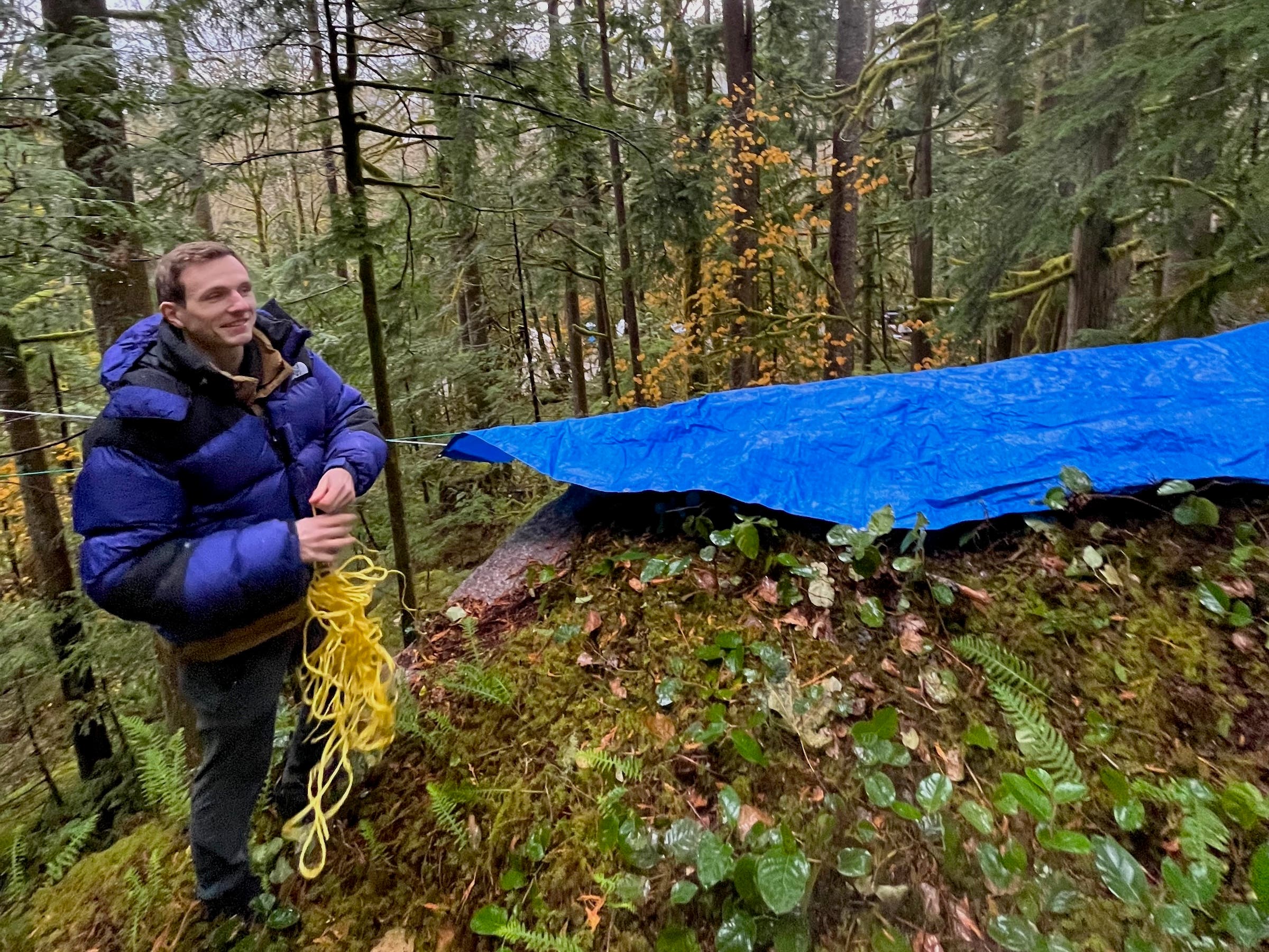 gabe lawson setting up a tarp