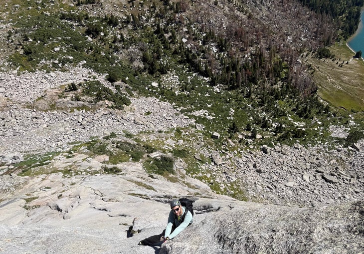 A climber in a crack on the northeast face of Pingora Peak.