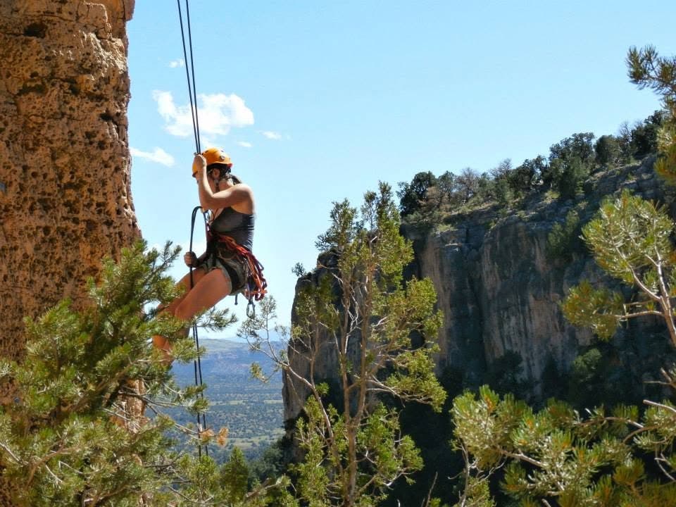 A climber rappelling