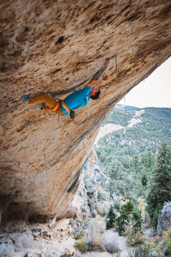 Justin Salas reaches for a far hold on 'America's Most Wanted' (5.13c)