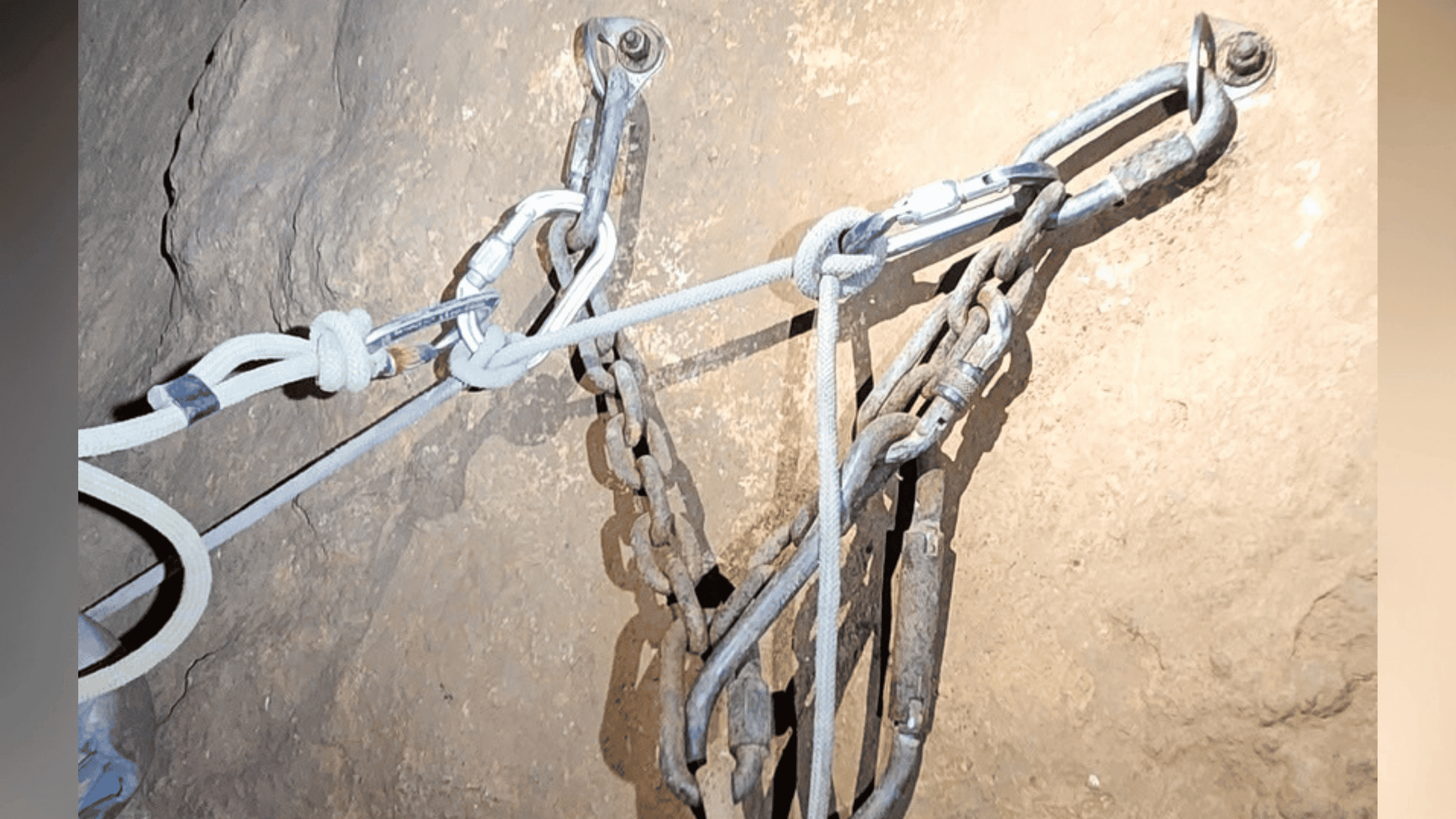a caver's climbing anchor by headlamp