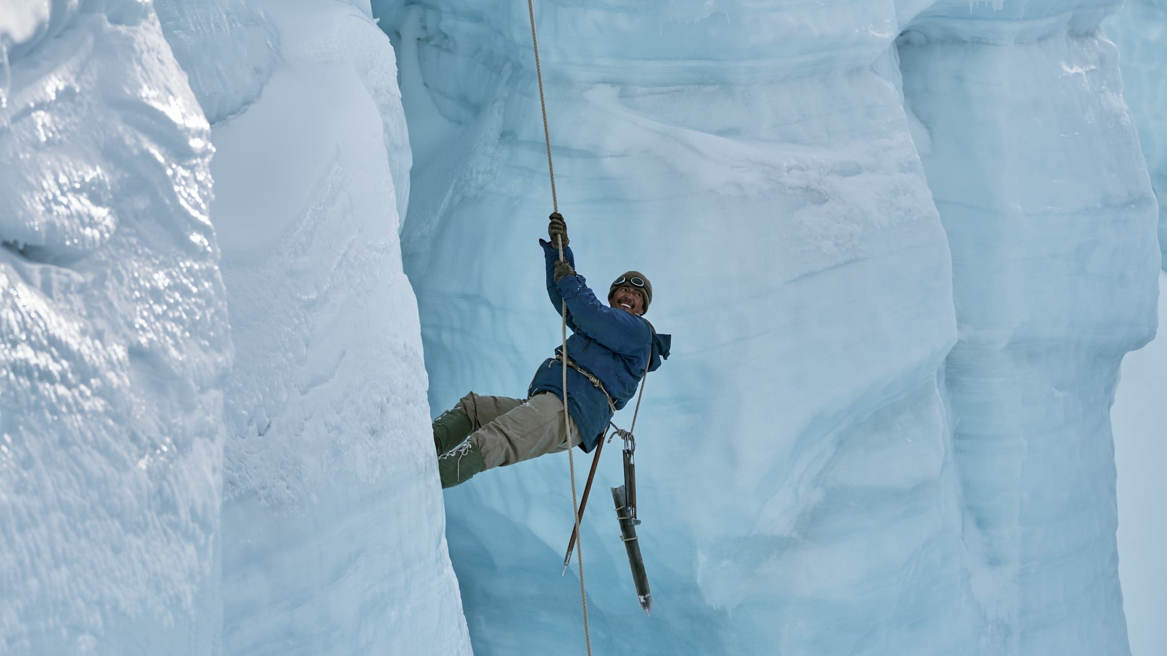 Genden Phuntsok hanging from a rope
