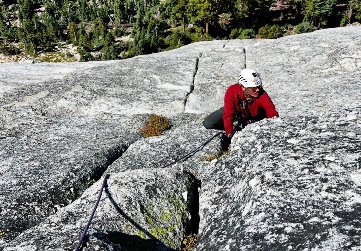 woman climbing a crack