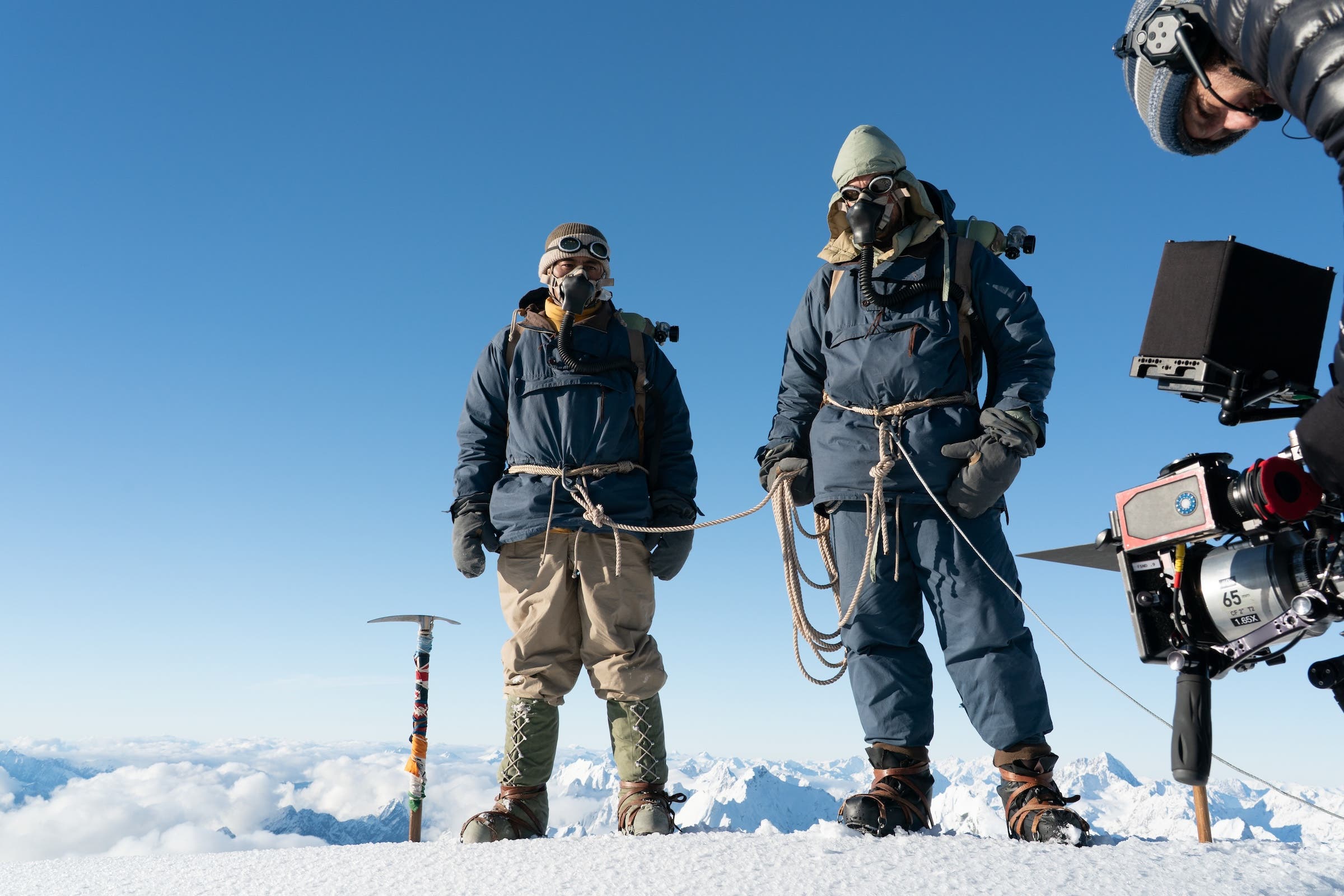 Two actors roped up on the mountain