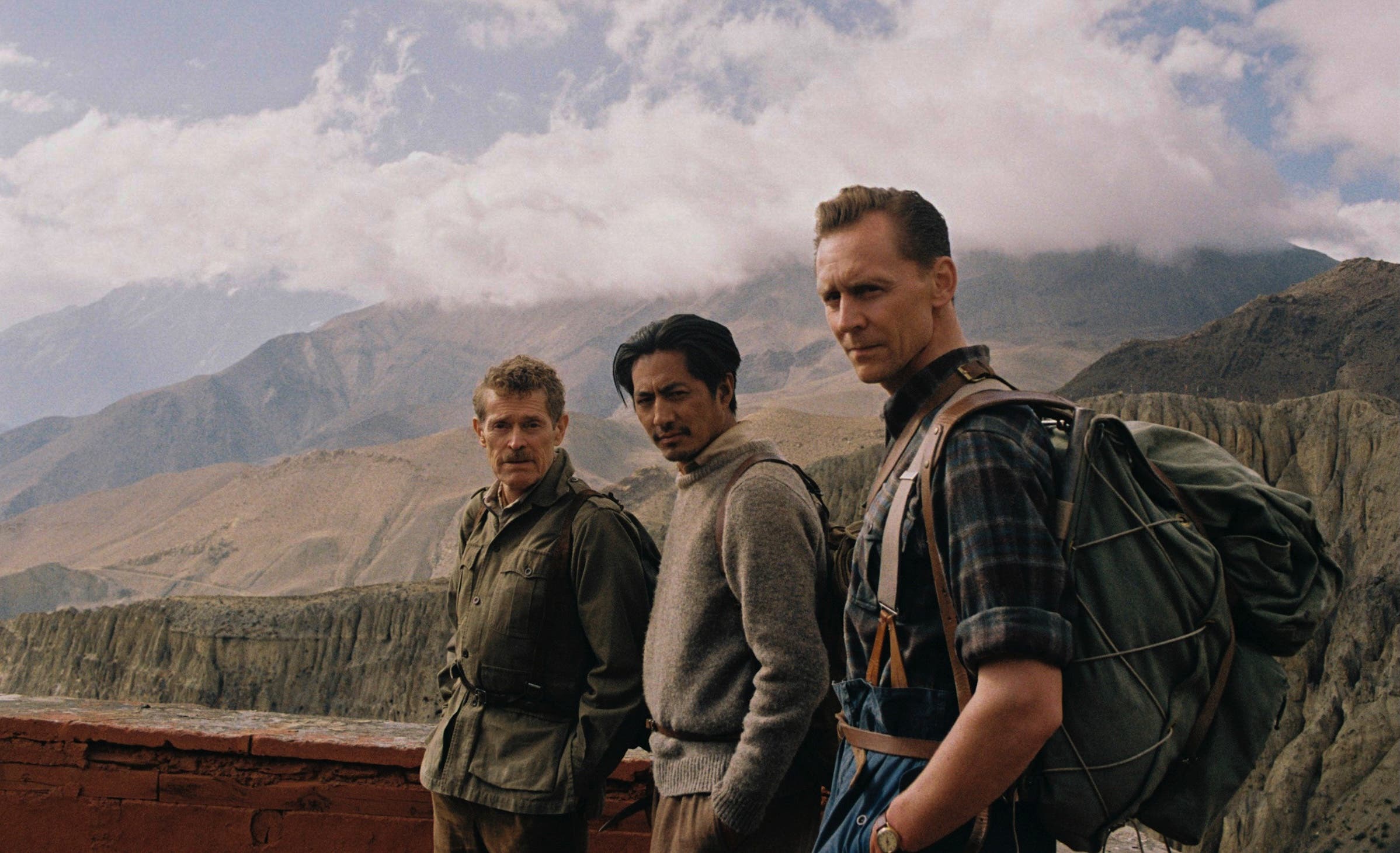 From left to right: Willem Dafoe, Genden Phuntsok, and Tom Hiddleston while shooting 'Tenzing'
